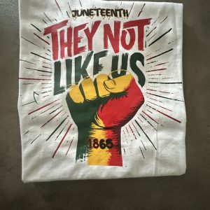 They Not Like Us Juneteenth Premium Graphic Tee custom DTF graphic tee printed by Beverly J. Hamilton in Cleveland, Ohio
